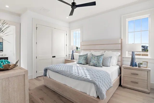 a view of a hallway to a livingroom with wooden floor