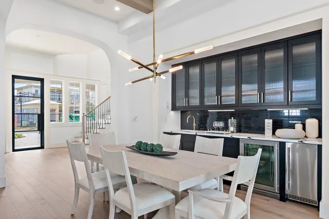 a kitchen with a table chairs and microwave
