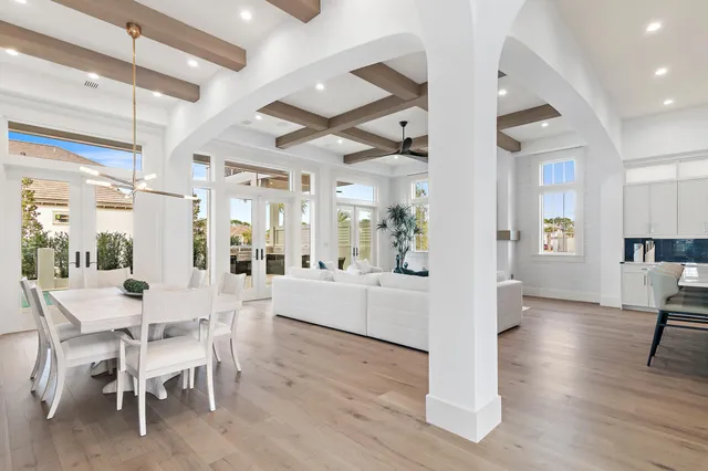 a dining room with furniture and wooden floor