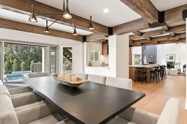 a living room with kitchen island furniture and a large window