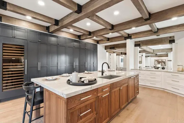 a kitchen with a stove a sink and a refrigerator