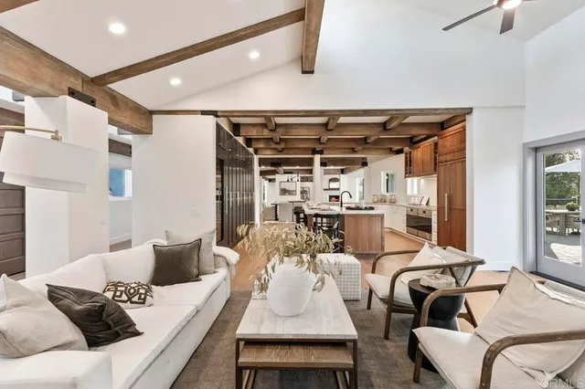 a living room with furniture and a table