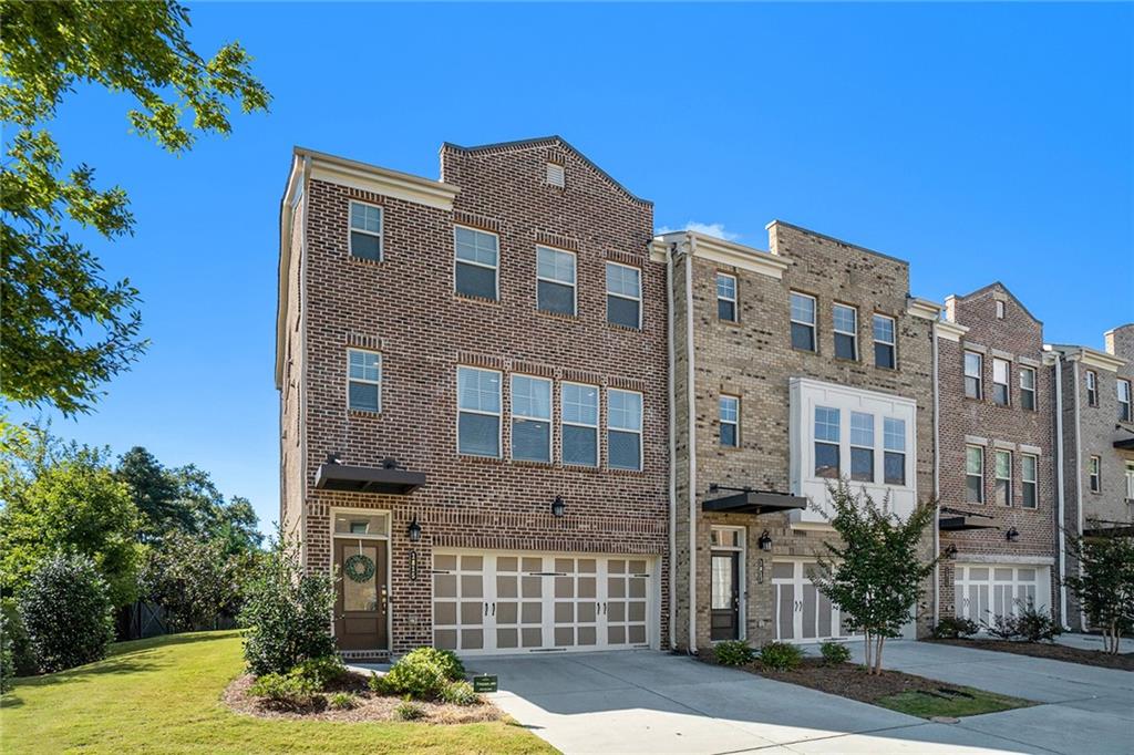 a front view of a building with garden