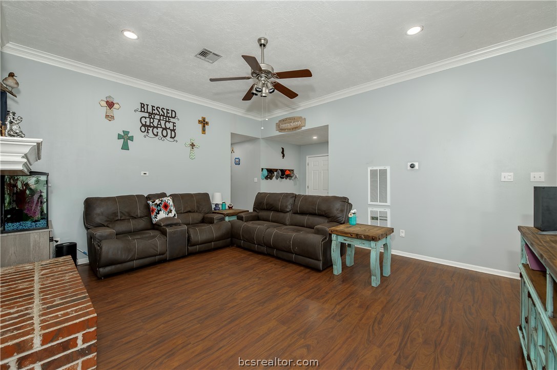 2009 Cobblestone Lane Bryan, TX 77807 - Photo 4 of 23 a living room with furniture and a wooden floor