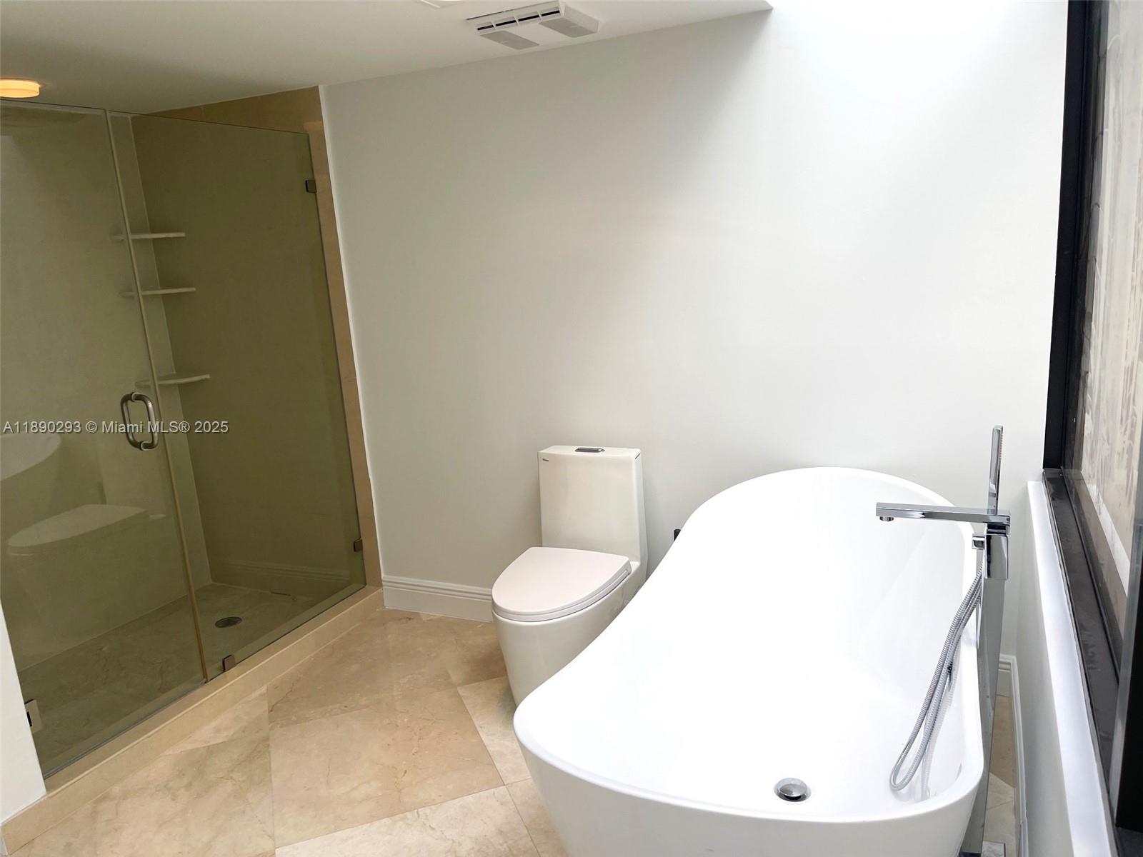 520 Brickell Key Drive, Unit UPH03 Miami, FL 33131 - Photo 35 of 35 a bathroom with a toilet and a sink