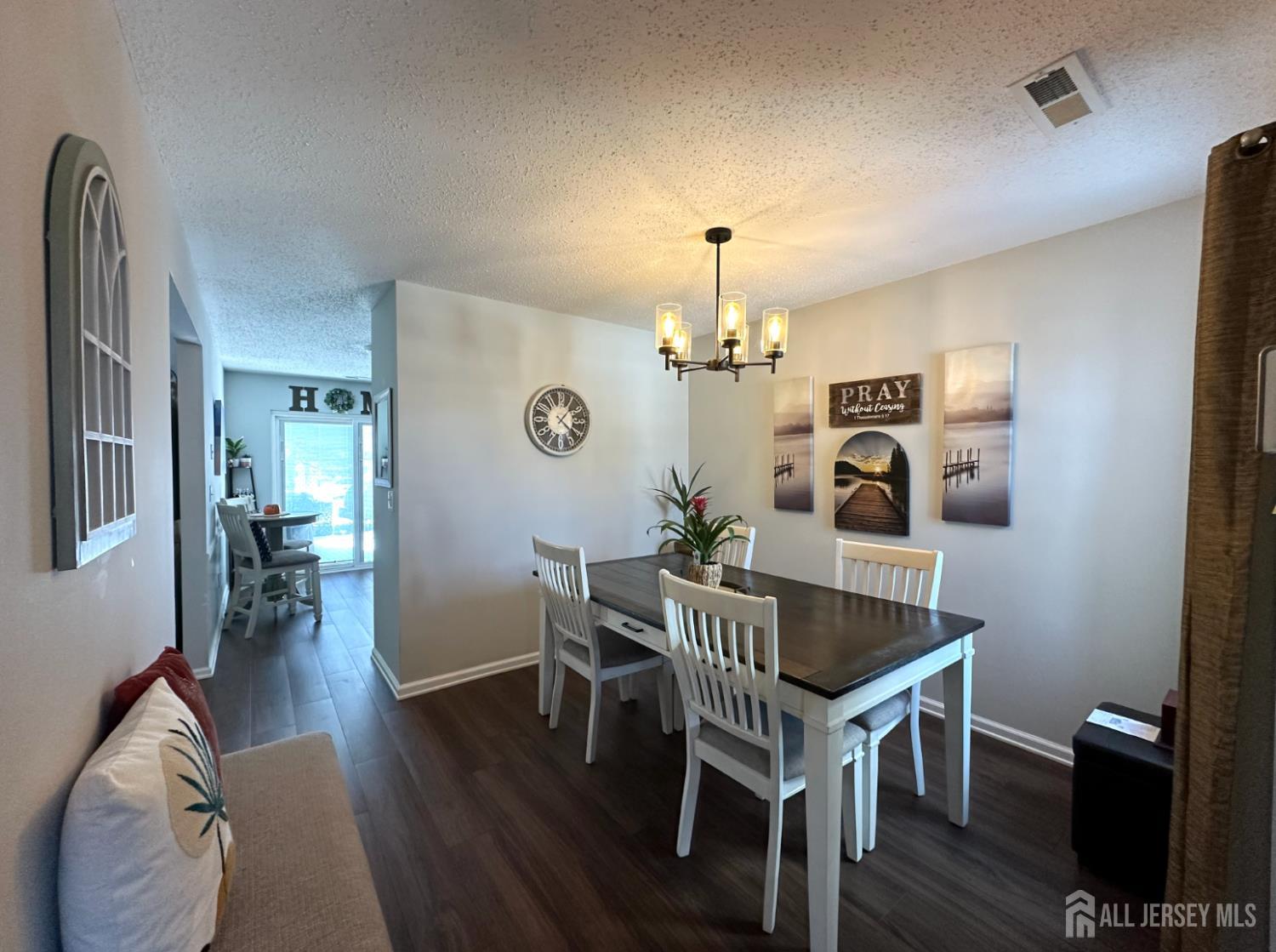 39 Renaissance Lane New Brunswick, NJ 08901 - Photo 3 of 16 a view of a dining room with furniture and wooden floor