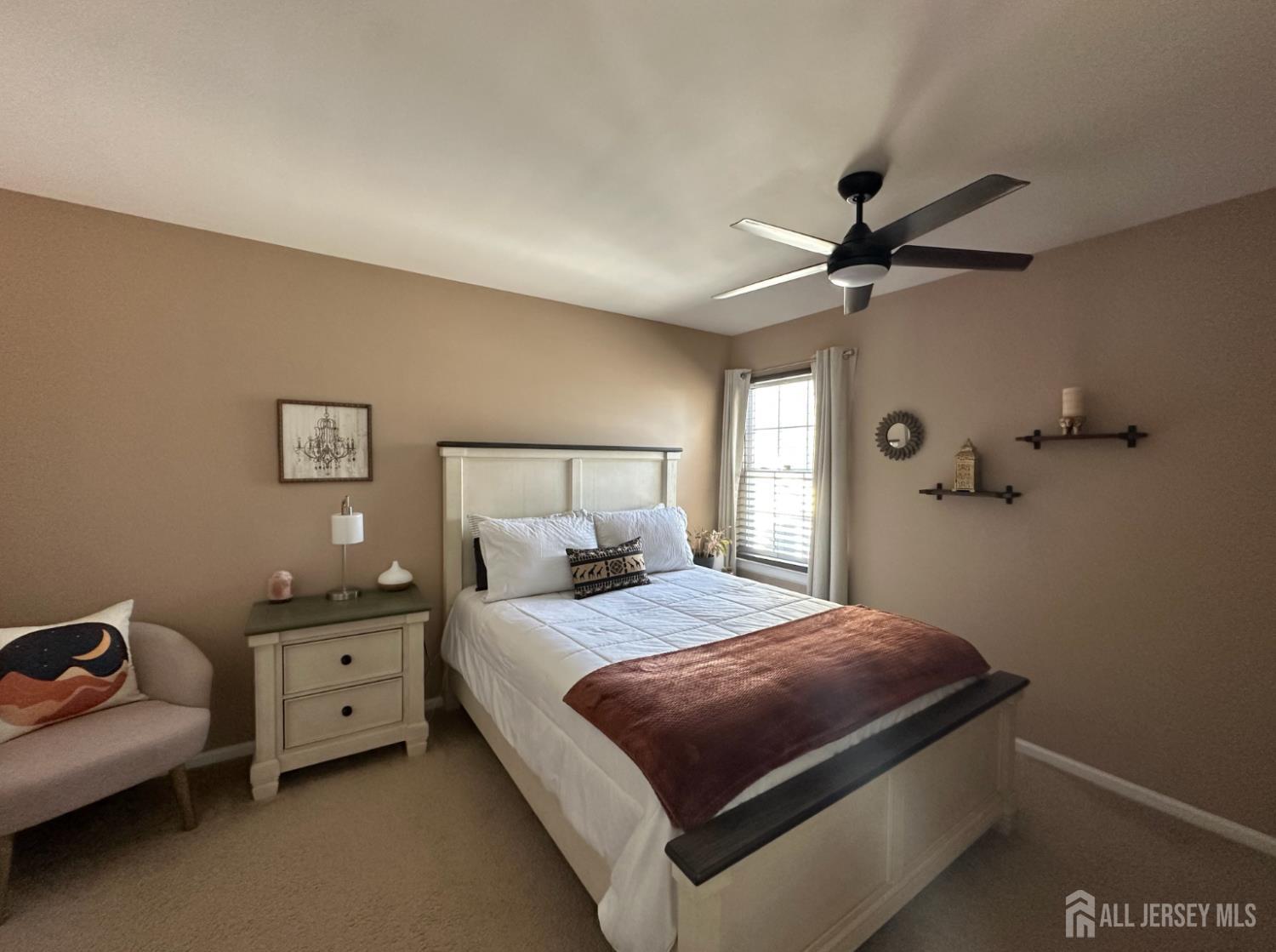 39 Renaissance Lane New Brunswick, NJ 08901 - Photo 8 of 16 a bedroom with a bed and a chandelier