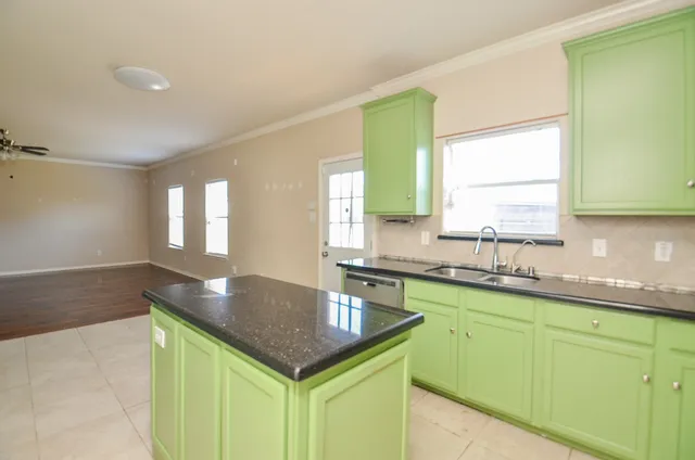 a kitchen with a sink and a window