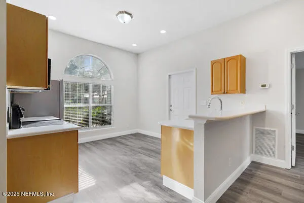 a view of cabinets and window