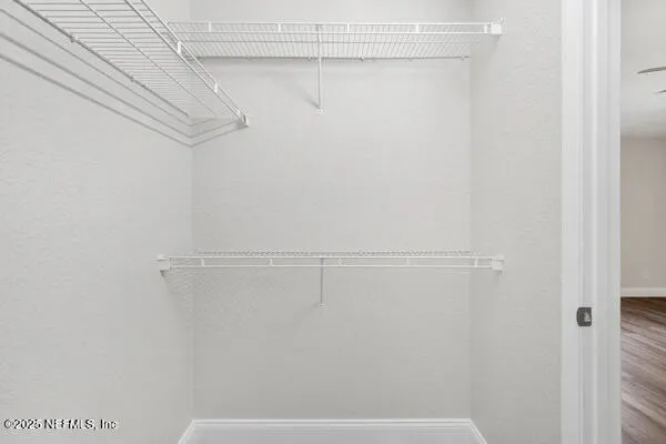 a view of a room with racks on the wall