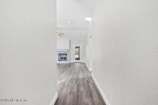 a view of a livingroom with wooden floor