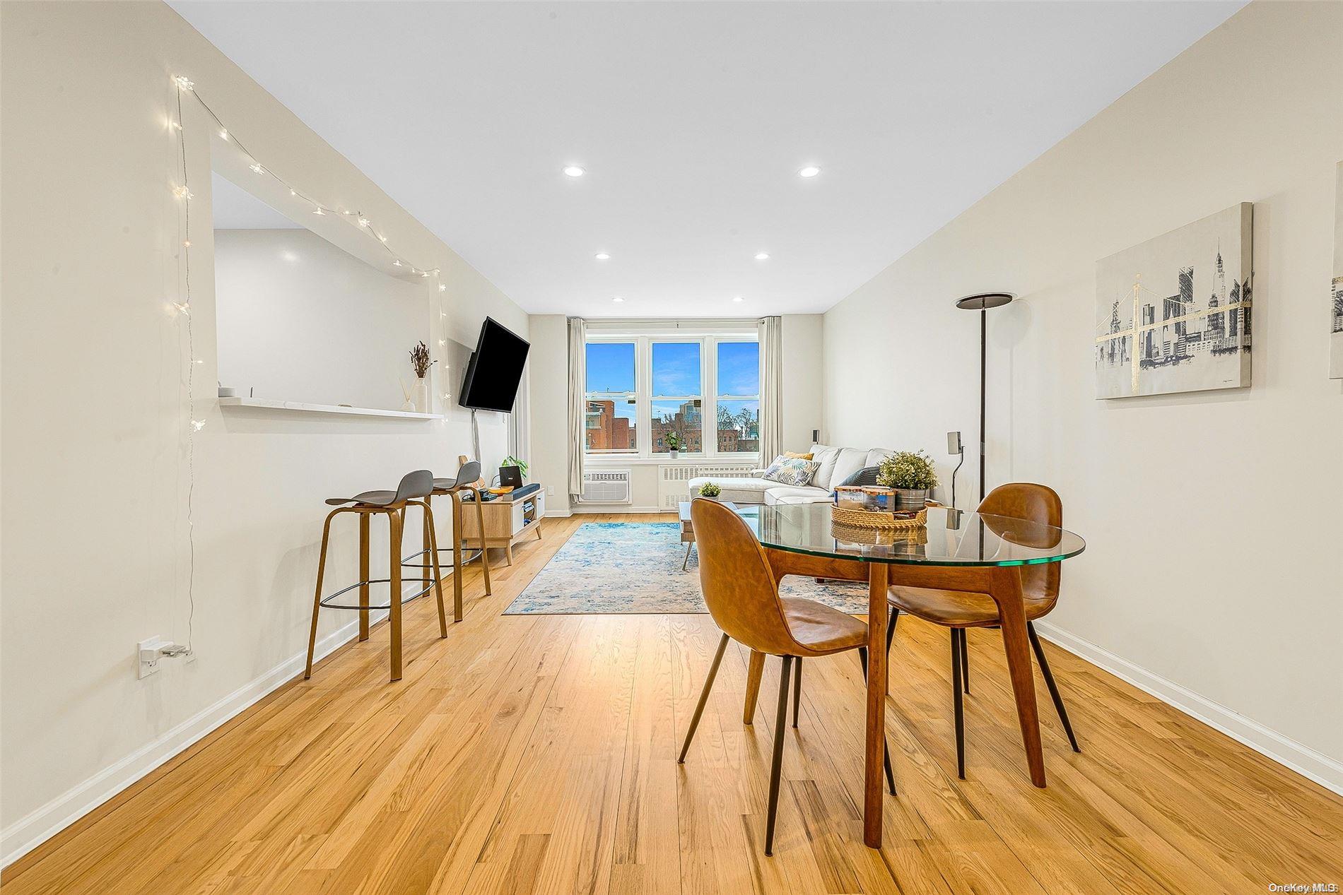 100-26 67th Road, Unit 6B Queens, NY 11375 - Photo 1 of 1 a view of a dining room with furniture and wooden floor