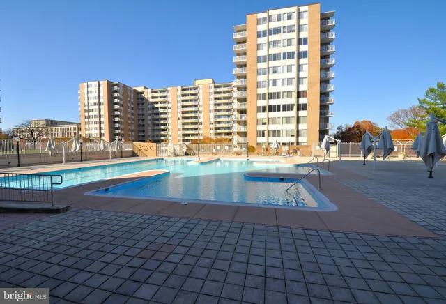 a room with gym equipment and large mirror