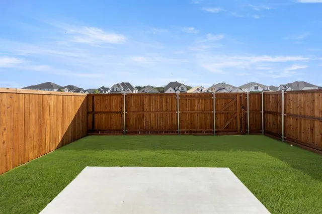 a view of a backyard with green space