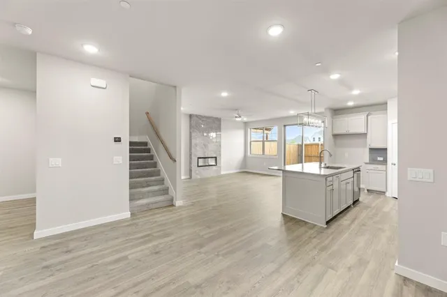 a view of kitchen with sink and wooden floor