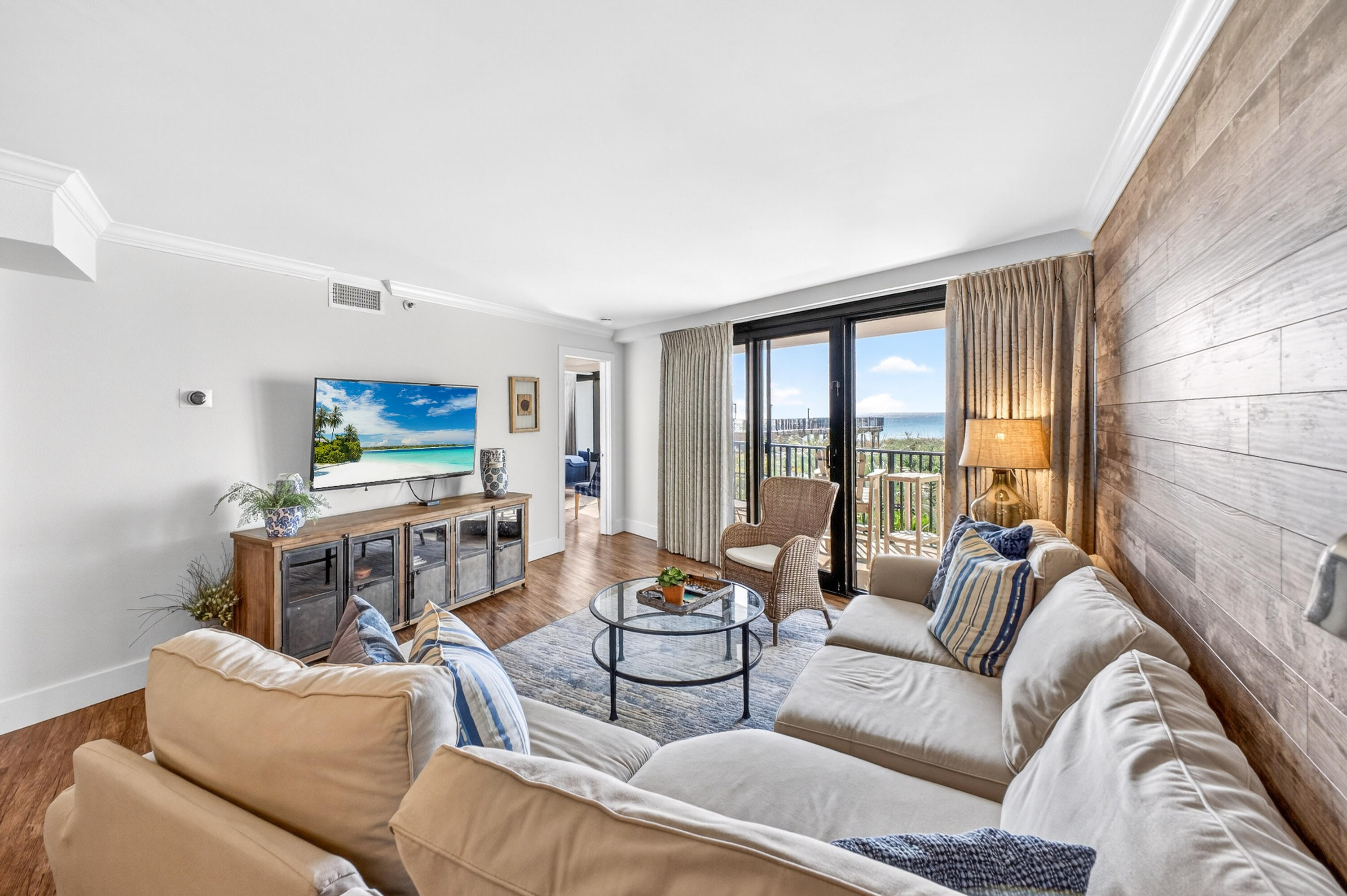 4024 Beachside 1, Unit 4024 Miramar Beach, FL 32550 - Photo 14 of 56 a living room with furniture and a flat screen tv