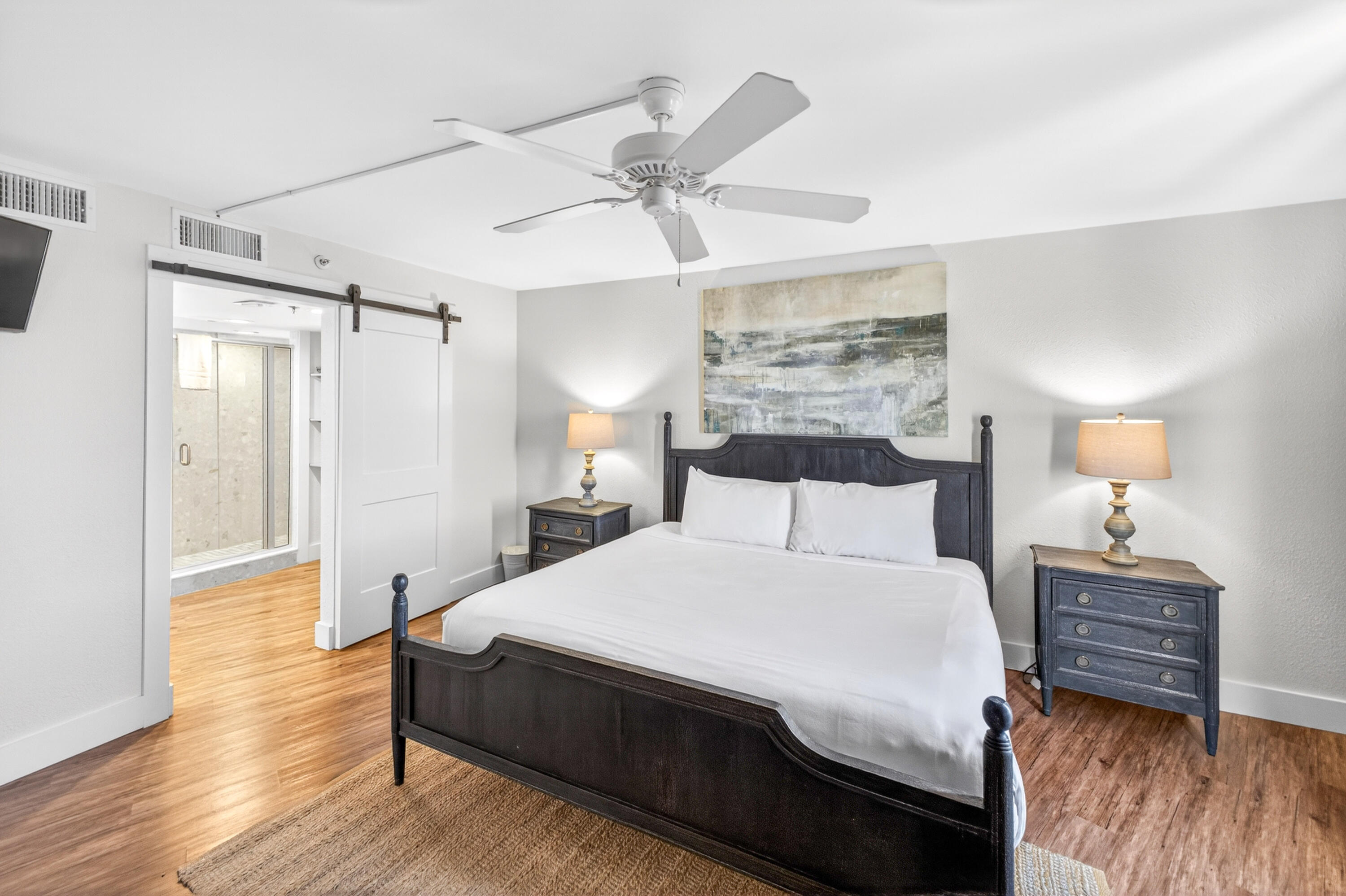 4024 Beachside 1, Unit 4024 Miramar Beach, FL 32550 - Photo 19 of 56 a spacious bedroom with a bed and a table