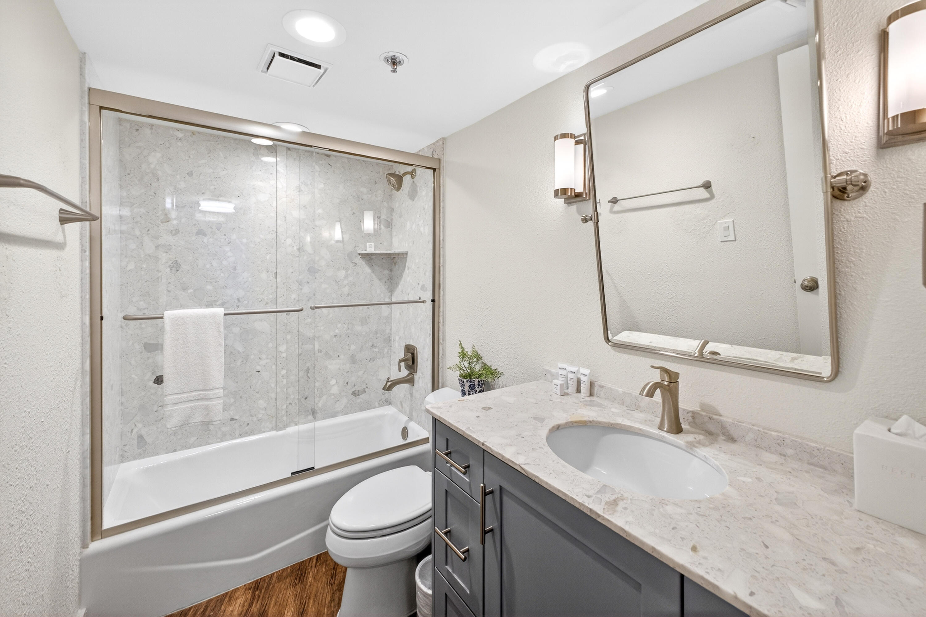 4024 Beachside 1, Unit 4024 Miramar Beach, FL 32550 - Photo 24 of 56 a bathroom with a granite countertop sink toilet and shower