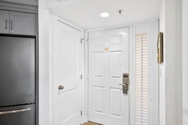a bathroom with a shower and a glass door