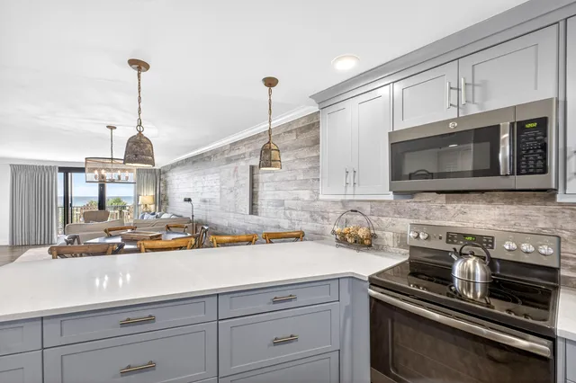 a balcony with table and chairs