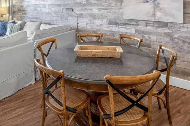 a dining room with furniture and window