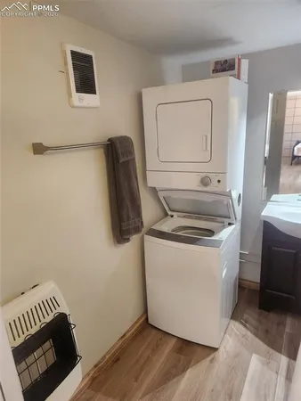 a kitchen with a refrigerator sink stove and cabinets