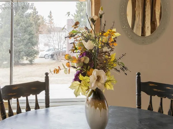 a vase of flowers sitting on a table