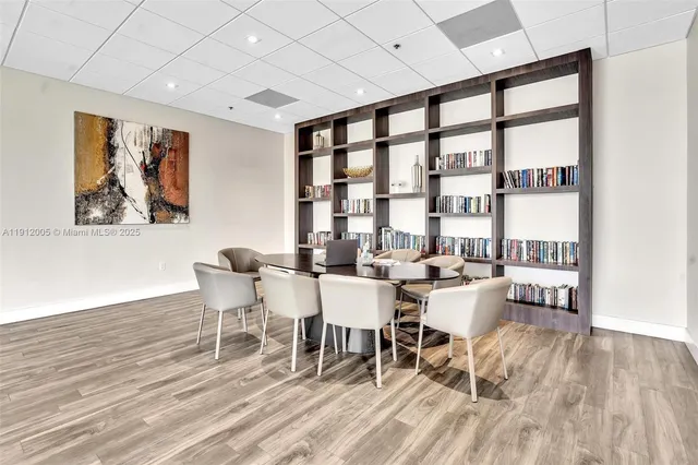 a view of a livingroom with furniture and white walls
