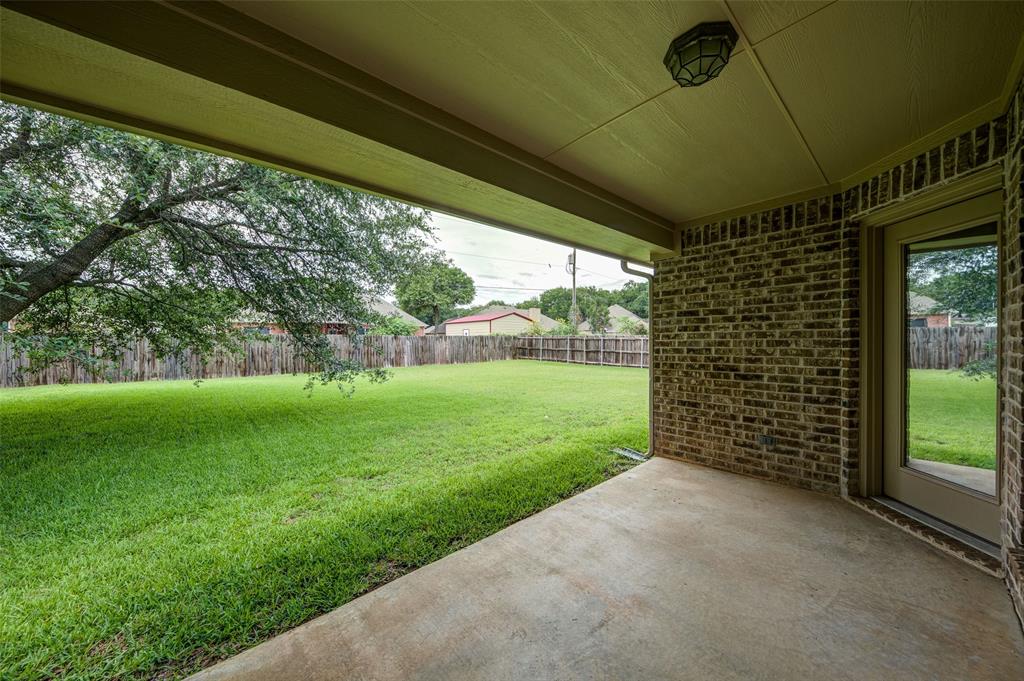 2105 Ridgewood Drive Bridgeport, TX 76426 - Photo 16 of 27 Covered back patio overlooking a spacious, fully fenced backyard.