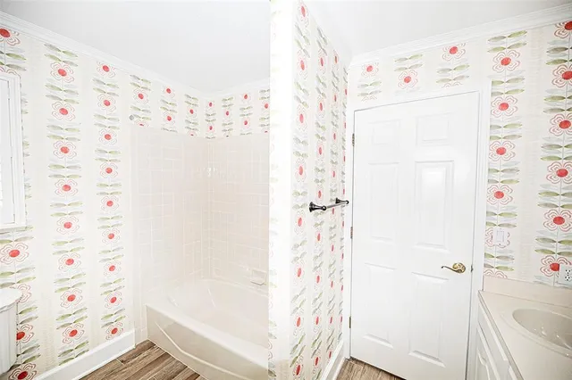 a bathroom with a shower curtain and a curtain