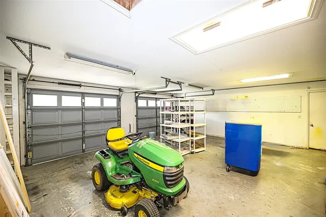 an aerial view of a house with a yard and lake view