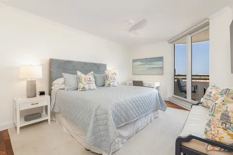 a bedroom with a bed and a couch