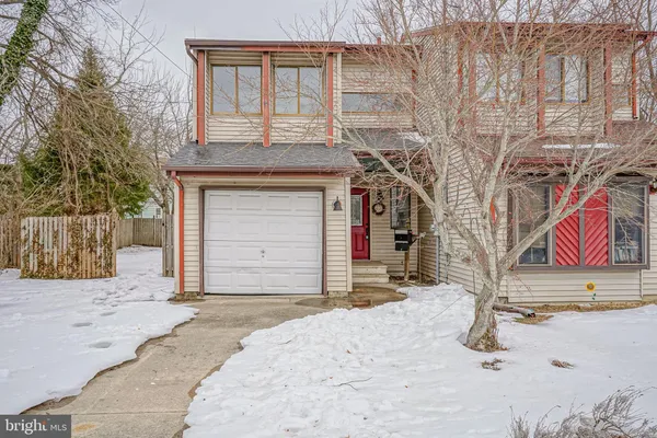 a front view of a house with parking area