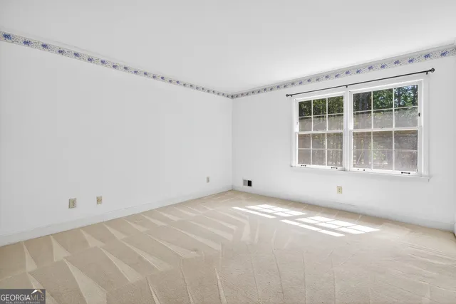 a view of a room with an empty shelves