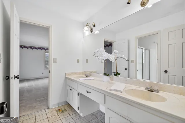 a bedroom with a bed and a chair