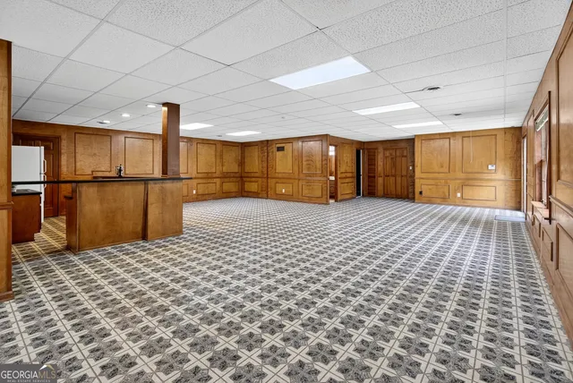 a swimming pool with outdoor seating and yard