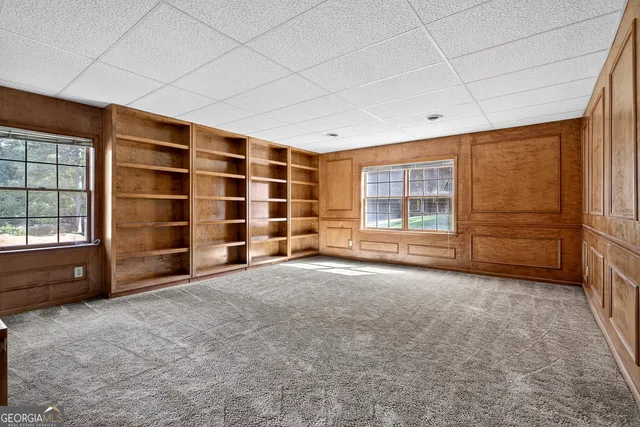 a swimming pool with some trees in the background