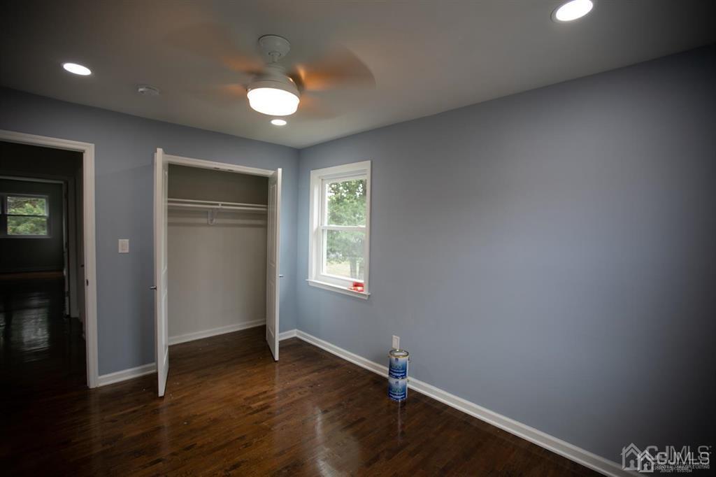 4208 Hana Road Edison, NJ 08817 - Photo 11 of 34 an empty room with wooden floor and windows