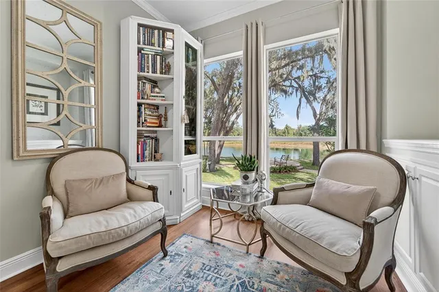 a living room with furniture and garden view