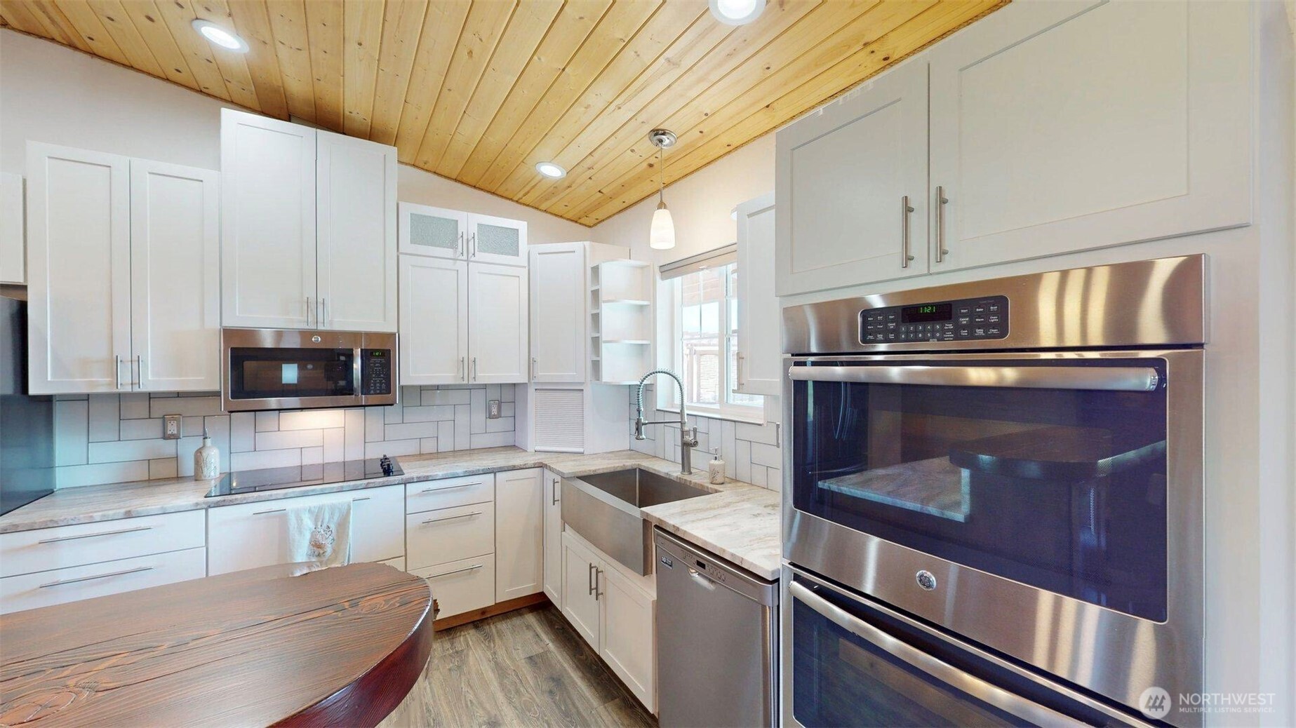 71 Shumway Road Omak, WA 98841 - Photo 12 of 40 a kitchen with a stove and a white refrigerator