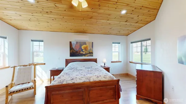 a living room with furniture and flat screen tv