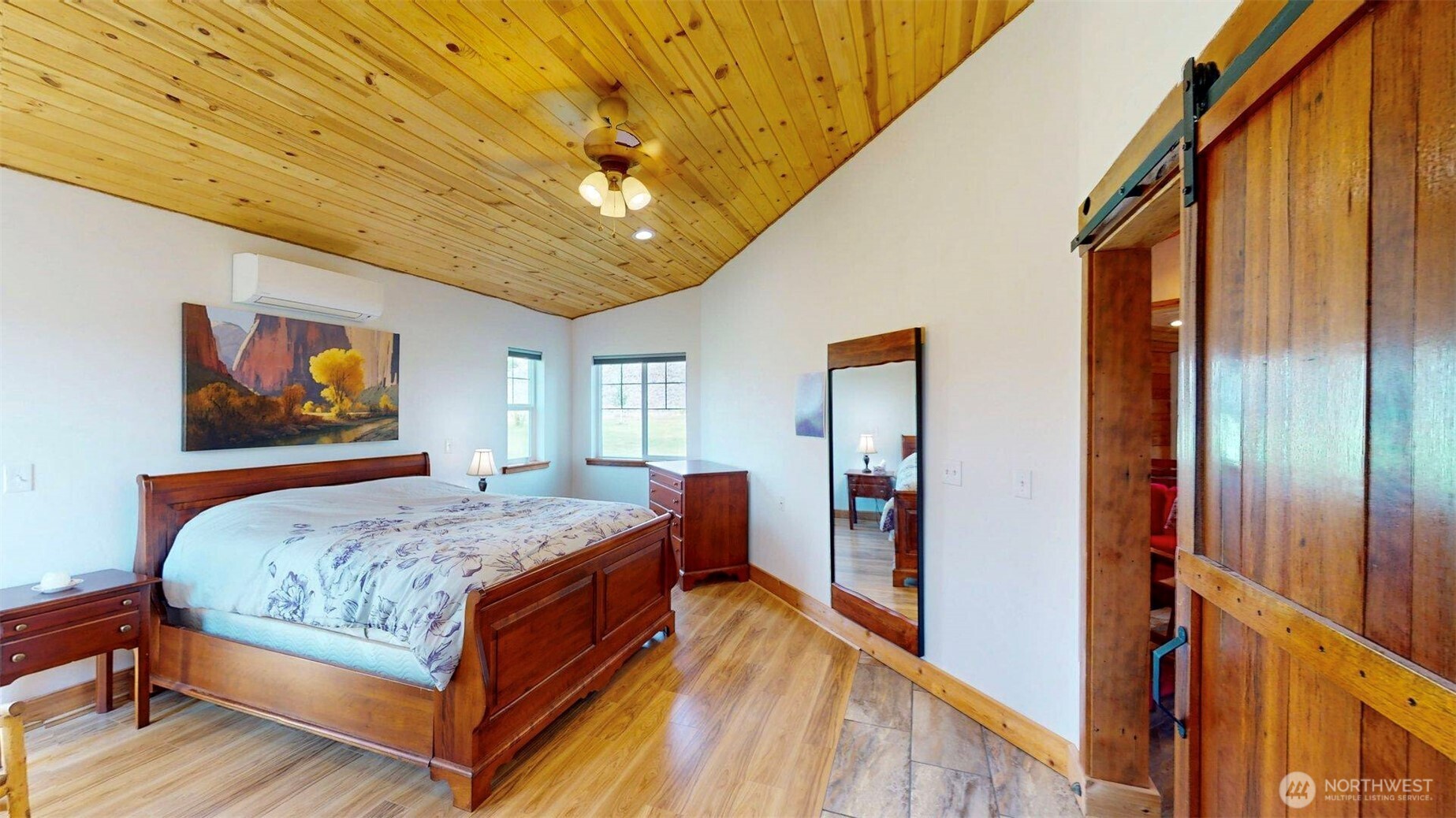 71 Shumway Road Omak, WA 98841 - Photo 15 of 40 a bedroom with bed and wooden floor