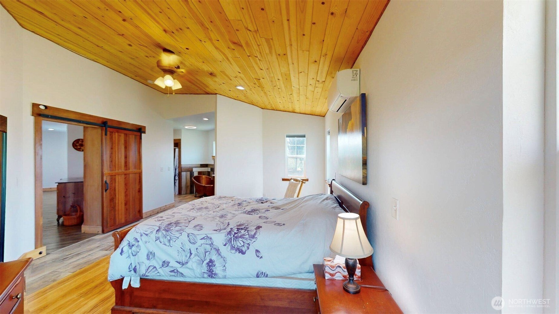 71 Shumway Road Omak, WA 98841 - Photo 16 of 40 a bedroom with a bed and a chandelier