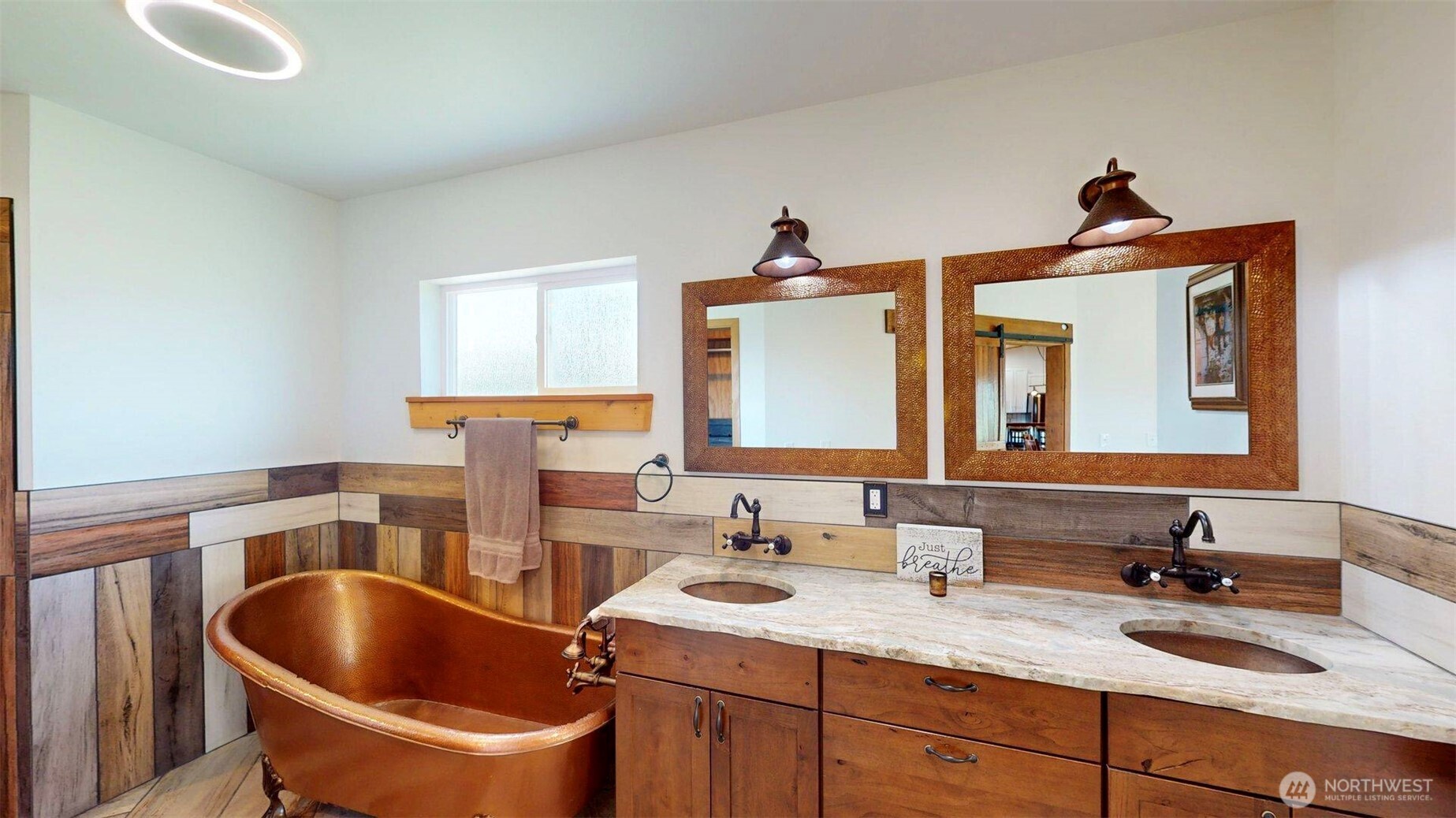 71 Shumway Road Omak, WA 98841 - Photo 17 of 40 a bathroom with a granite countertop sink a toilet and mirror