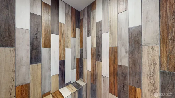 a view of a bathroom from a glass door