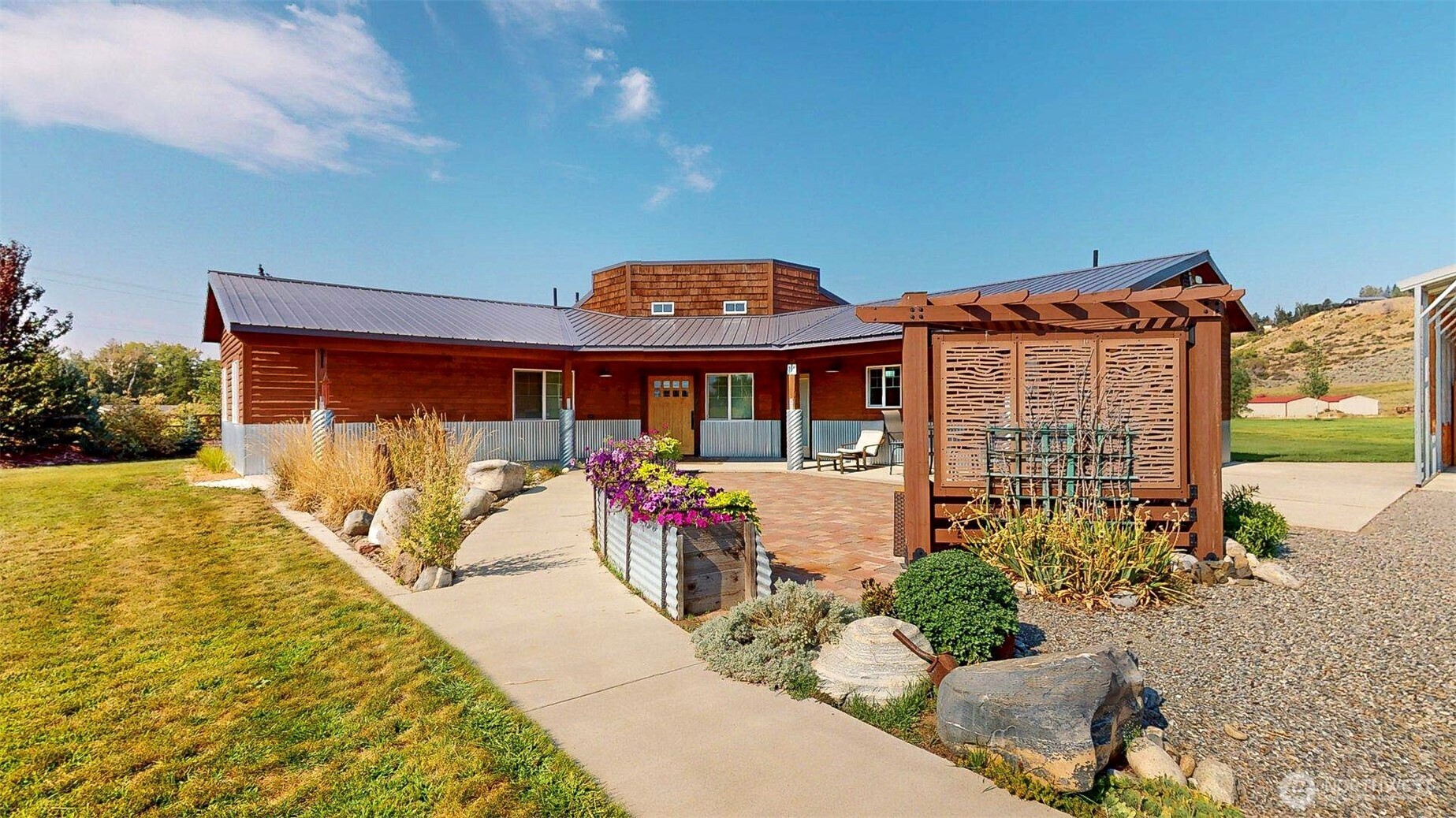 71 Shumway Road Omak, WA 98841 - Photo 2 of 40 a front view of a house with a porch