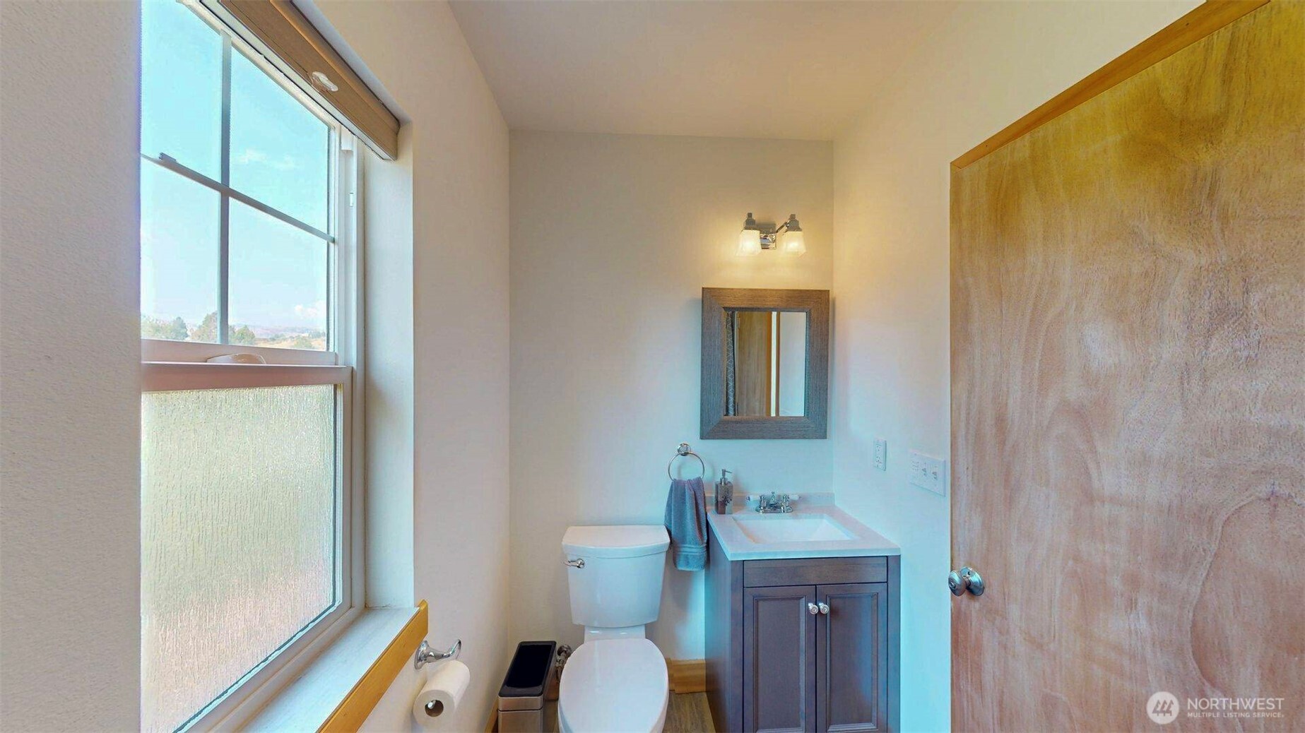 71 Shumway Road Omak, WA 98841 - Photo 21 of 40 a bathroom with a sink a toilet and mirror