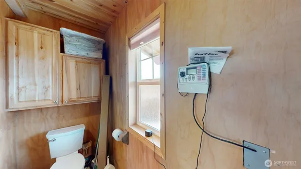 a bathroom with a toilet a sink and shower