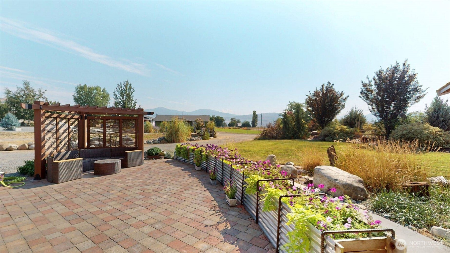 71 Shumway Road Omak, WA 98841 - Photo 30 of 40 a front view of a house with a ocean view