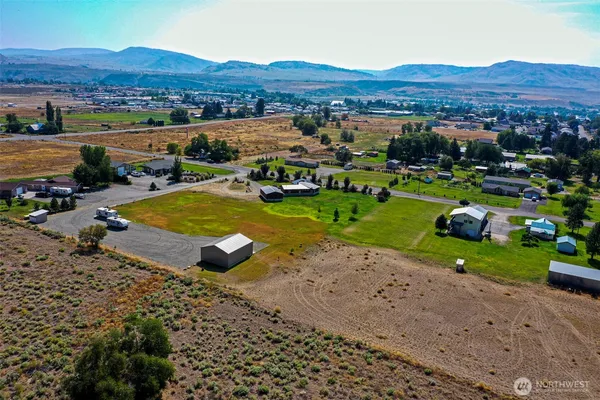 an aerial view of a house with mountain view